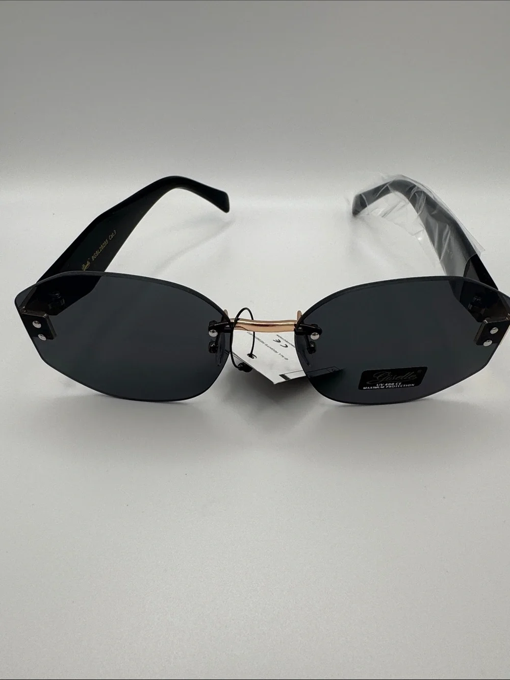 Stylish Black Rimless Women's Sunglasses with Gold Bridge